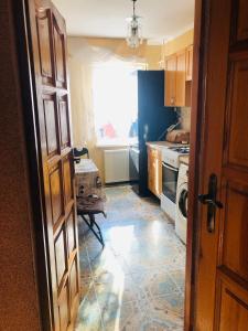 an open door to a kitchen with a stove top oven at Апартамени 1 кімнатна Суховоля in Truskavets