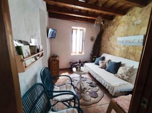 Televízia a/alebo spoločenská miestnosť v ubytovaní Besara Vejer + 16 fotografií