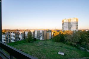 a view of a city from the balcony of a building at T&K Apartments Comfortable 3 Room Apartments with Balcony in Duisburg
