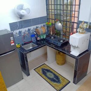 Кухня или мини-кухня в khairul homestay taman tengiri seberang jaya
 +4 фотографии