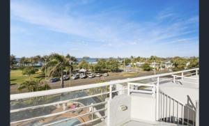 a view from a balcony of a beach with a view of the ocean at Sundeck Gardens in Maroochydore