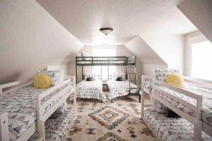 a bedroom with two bunk beds in a attic at *Spacious, Modern Mountain Vacation Home!* in Provo