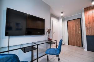 Telewizja i/lub zestaw kina domowego w obiekcie CITYSTAY Plac Unii Gdynia Apartment