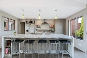A kitchen or kitchenette at Hobart panoramic view with Spas