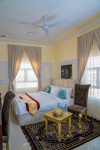 Säng eller sängar i ett rum på Arkan Al Barzah Hotel Apartment