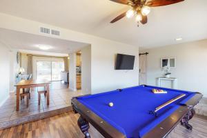 a pool table in a living room with a ceiling at Everlasting Phoenix in Phoenix