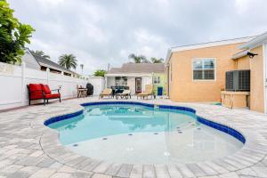 a swimming pool in the backyard of a house at Bay Escape & Ocean Away in Clearwater Beach