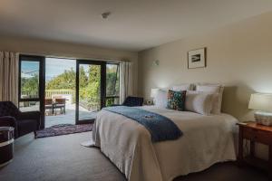 Uma cama ou camas num quarto em Rimu Lodge