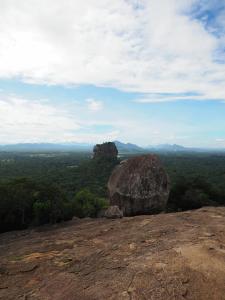 a large rock sitting on top of a mountain at Habarana Dulwan Guest House in Habarana