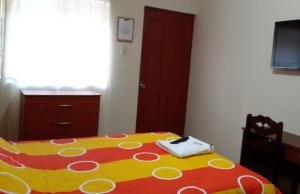 Postel nebo postele na pokoji v ubytování Hostal La Casona
