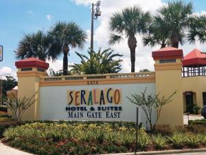 a sign for a hotel and suites main gate east at Seralago Hotel & Suites Main Gate East in Orlando