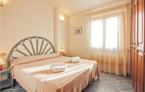 a bedroom with a bed with a large window at Beach Front Home In Ca- With Wifi in Monte Nai
