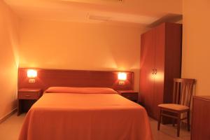 Postel nebo postele na pokoji v ubytování Hotel Sette E Mezzo