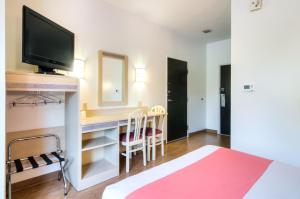 TV a/nebo společenská místnost v ubytování Motel 6-Joliet, IL - Chicago - I-55