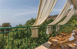 a balcony with a view of the mountains at Amazing Home In Gornje Tucepi With Kitchen in Tučepi