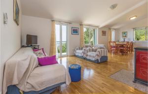 a living room with a couch and chairs and a table at Amazing Home In Gornje Tucepi With Kitchen in Tučepi