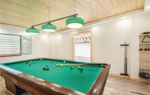 a pool table in a living room with at Gorgeous Home In Sant'angelo Romano in SantʼAngelo Romano