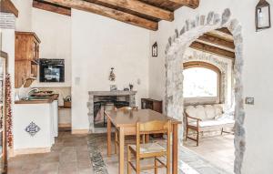 a kitchen with an archway and a table and chairs at 24 Colle in Gaeta