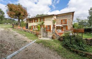 an old stone house with a gate in front of it at Nice Home In Dicomano Fi With 4 Bedrooms, Private Swimming Pool And Wifi in Villore