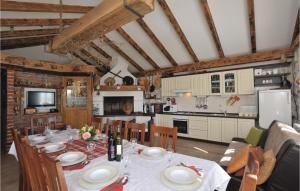a dining room and kitchen with a table and chairs at Gorgeous Home In Razanj With Wifi in Ražanj