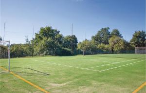 a tennis court with two tennis courts at Castello Rocchette in Celleno