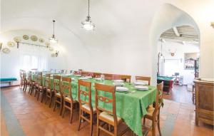a long dining room with a long table and chairs at Castello Rocchette in Celleno
