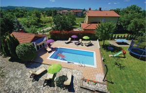 an aerial view of a backyard with a swimming pool at Awesome Home In Vinez With House A Panoramic View in Vinež