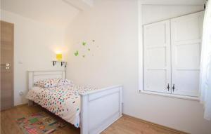 Posteľ alebo postele v izbe v ubytovaní Two-Bedroom Holiday Home 0 In Filipana