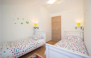 Posteľ alebo postele v izbe v ubytovaní Two-Bedroom Holiday Home 0 In Filipana