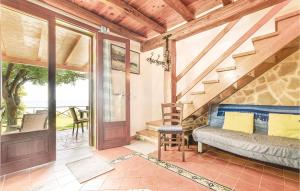 a living room with a couch and a staircase at Gorgeous Home In Menfi Ag With Wifi in Porto Palo +14 photos