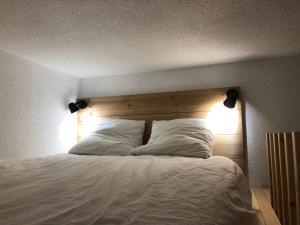 Llit o llits en una habitació de Appartement vue imprenable avec emplacement idéal