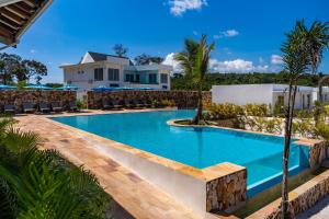 a swimming pool in front of a villa at You&Me Resort in Koh Rong Island