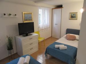 Posteľ alebo postele v izbe v ubytovaní Apartment Lela Split II
