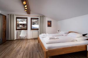 מיטה או מיטות בחדר ב-Alpine View Apartments