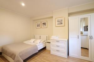 Posteľ alebo postele v izbe v ubytovaní Wood Creek Apartments
