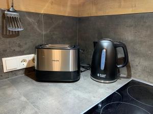A kitchen or kitchenette at Schusterbrand Appartements