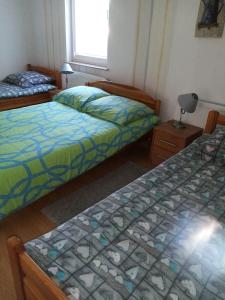 Posteľ alebo postele v izbe v ubytovaní Apartament STOKROTKA