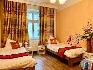 Postel nebo postele na pokoji v ubytování Blue Rose Apartman