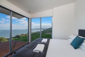a hotel room with a view of the ocean at Seafarers Getaway in Apollo Bay