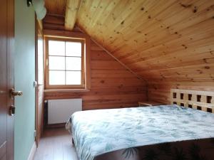 A bed or beds in a room at Guest House Unguri