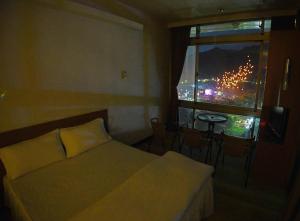 A bed or beds in a room at Very Happy Homestay