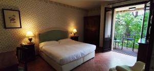 Postel nebo postele na pokoji v ubytování Relais Il Canalicchio Country Resort & SPA