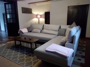 a living room with a couch and a coffee table at Le Relais du Malpas in Namur