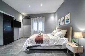 Posteľ alebo postele v izbe v ubytovaní L apartment