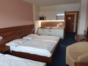 Postel nebo postele na pokoji v ubytování Apartmán Wellness hotel Frymburk