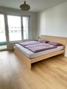 A bed or beds in a room at Nová Nuselská