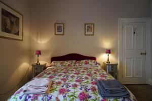 En eller flere senger på et rom på Botanic View B&B