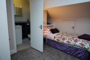 En eller flere senger på et rom på Botanic View B&B