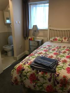 En eller flere senger på et rom på Botanic View B&B