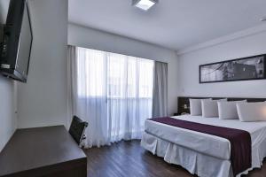 Postel nebo postele na pokoji v ubytování Flat com Varanda-Pampulha